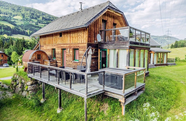 Alpine house with a unique barrel sauna