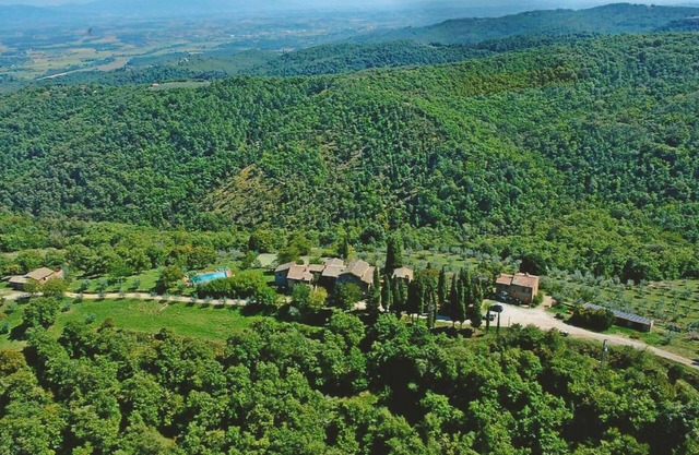 Ancient hamlet in an extremely panoramic position, nestling amidst green woods and hills, a few km f