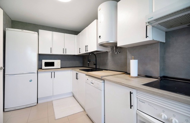 Apartment 'Playa Del Lar' with Shared Pool, Wi-Fi and Air Conditioning