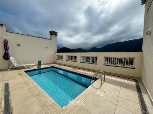 Apto com Churrasqueira e Piscina em região central