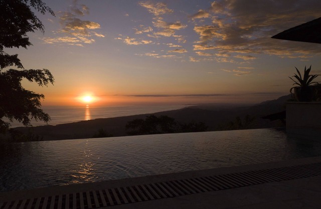 Balinese Mountaintop Villa with 100 miles of unobstructed Pacific Ocean views.