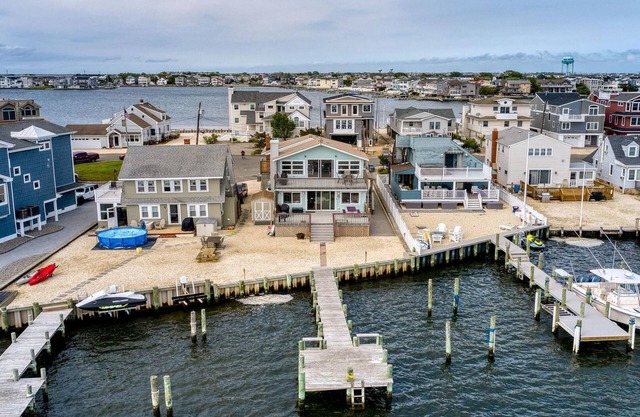 Bay Front 2nd floor duplex boasts amazing bay views from both porch and deck.