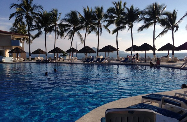 Beach front condo oasis with the best pool in town!