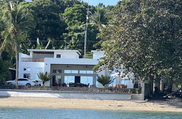 Beachfront. Direct access to safe sandy beach.