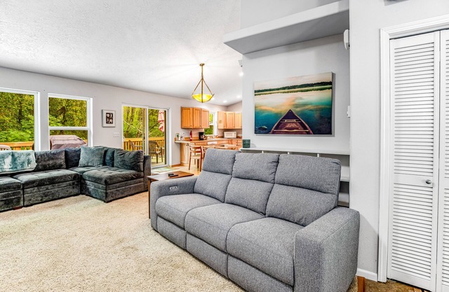 Beautiful home with large deck, gas grill, nestled around the trees