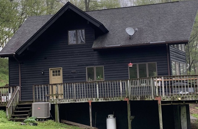 Beautiful unique A frame house on 15ac located directly on a great trout river