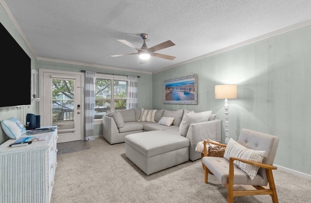 Beautifully decorated condo in Corolla with community pool outside!