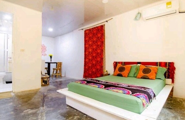 Bedroom with air conditioning and private bathroom near the beach.