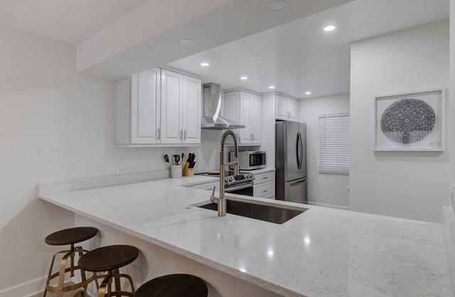Brand New Renovated Unit with Partial Ocean View and Heated Pool, Hot Tub and Tennis Court