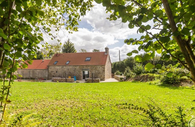 Bright family home with spa, private garden and children's games.