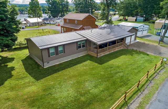 Bring your boat, this home offers a dock to tie up to and 10 feet of lakefront.