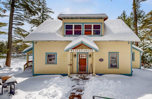 Captivating lakefront home with private dock, row boat, firepit, and lake views