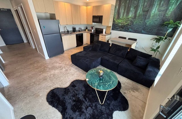 Charcoal Loft | Modern 2BR Downtown Retreat with Fireplace & Gym Access