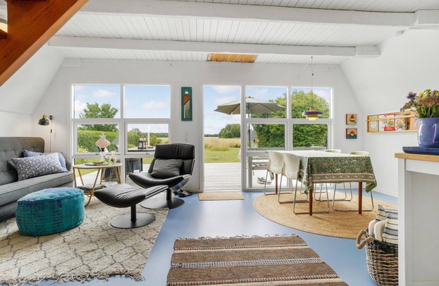 Charming cottage with fireplace and beautiful view of fields.