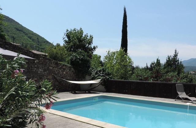 Charming holiday home with large swimming pool, nestled in a mature garden.