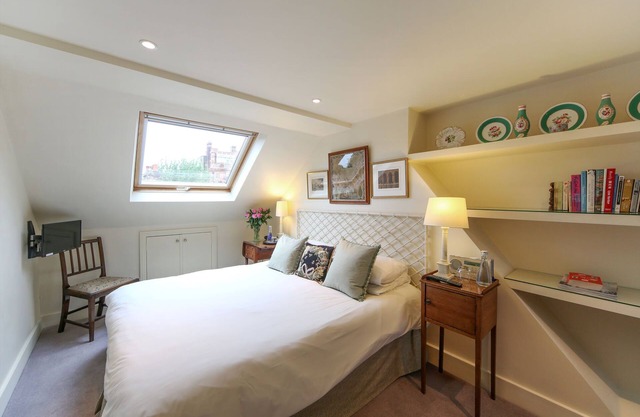 Comfortable double bedroom with ensuite bathroom, sitting room & roof terrace