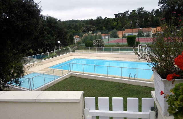 Comfortable villa overlooking swimming pool and tennis court, secure residence