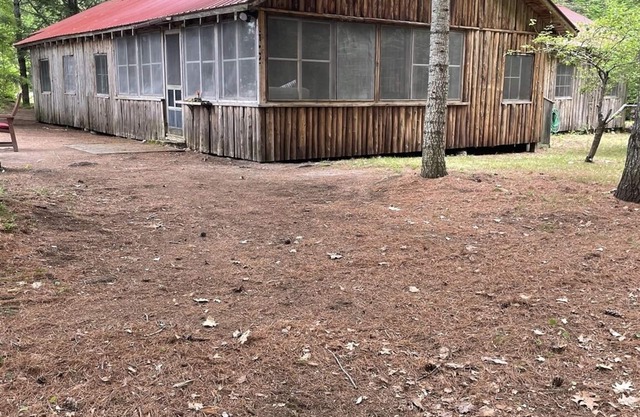Cottage nestled in the woods overlooking Sebago Lake.