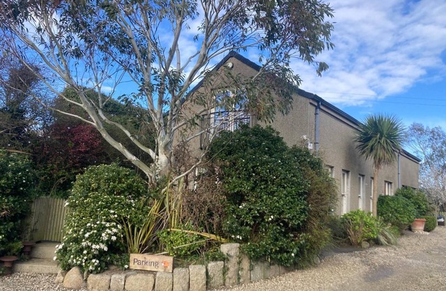 Country cottage in peaceful setting, nestled between the mountains and the sea.