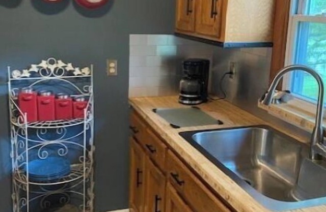 Cozy home conveniently located within city limits…Greenway across street!