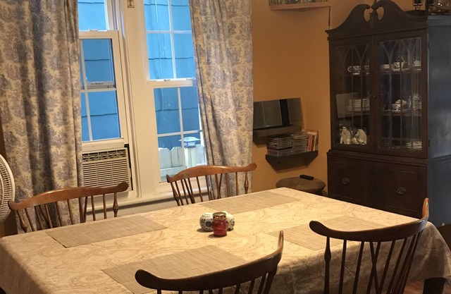 Cozy house on a quiet street with a charming deck! 5 minutes walk to NYC train!