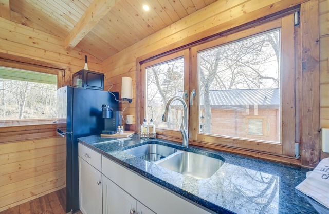 Cozy Smokies Tiny Home Cabin complete with a deck & mountain views.