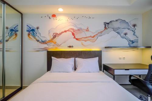 Cozy Stay and Tidy Studio at Evenciio Margonda Apartment By Travelio