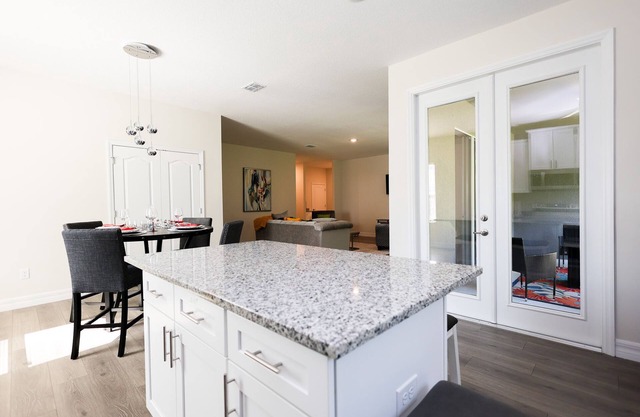 Discover Palm Bay by staying at this picturesque four-bed, three-bath home.