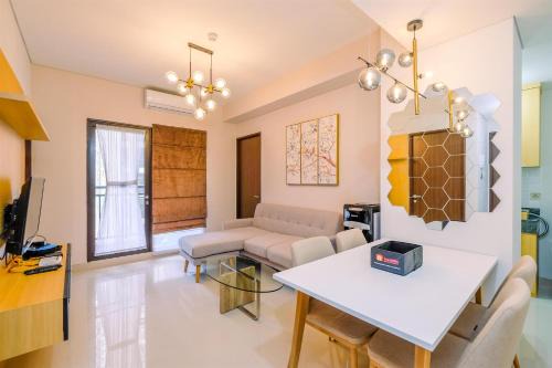 Elegant and Comfy 3BR Transpark Cibubur Apartment By Travelio