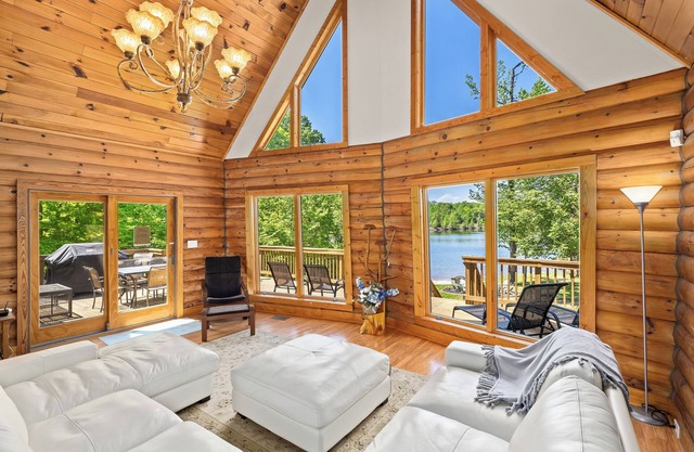 Enchanting 5-Bed/5-Bath Lakefront Log Cabin with Private Cove and Sandy Beach.