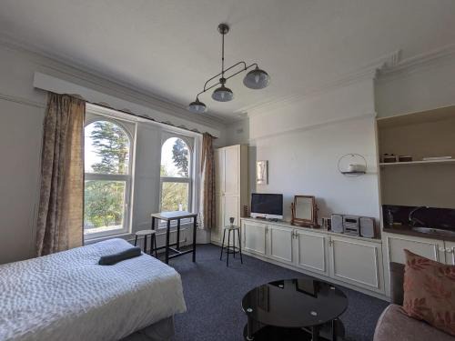 Ensuite triple room by Swansea University Hospital v