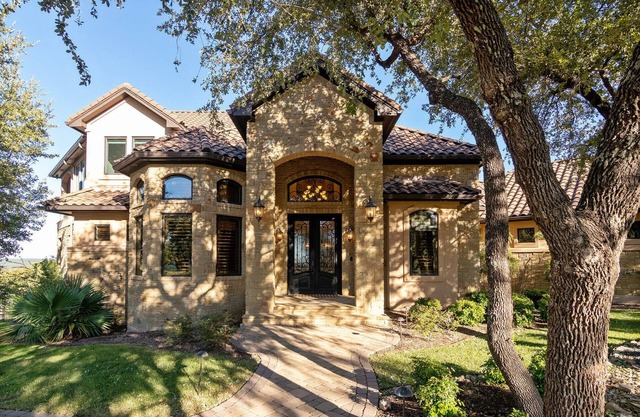 Executive home with hill country views in gated golf community with amenities
