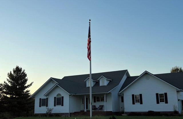 Fully custom modern four bedroom home on 13 acres with a stocked pond.
