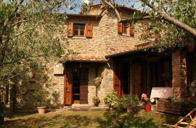 Fully detached and fenced stone cottage with an outside porch. Garden equipped with table, chairs, d