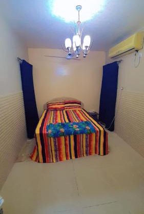 Fully Furnished bedroom with shared bathroom in a villa sharjah