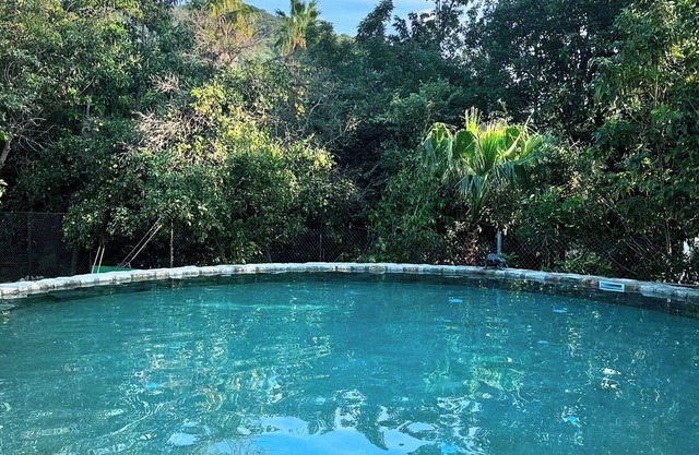 Glamping orchard and suites with large stone kitchen and pool in Baja Sur.