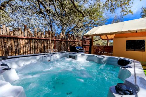 Glamping Vacations in a Luxury Tented Cabin near River Guadalupe, in Ingram, Texas