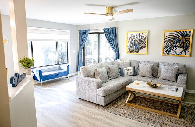 Golf course adjacent, beach-themed condo with sunroom, washer/dryer, & AC