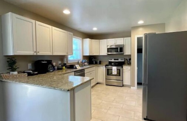 Hidden Gem spacious 4 bedroom cozy home fenced in yard