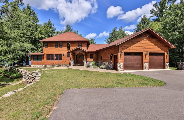 History-filled lakefront home with dock, fire pit, fireplace, & kayaks - dogs OK