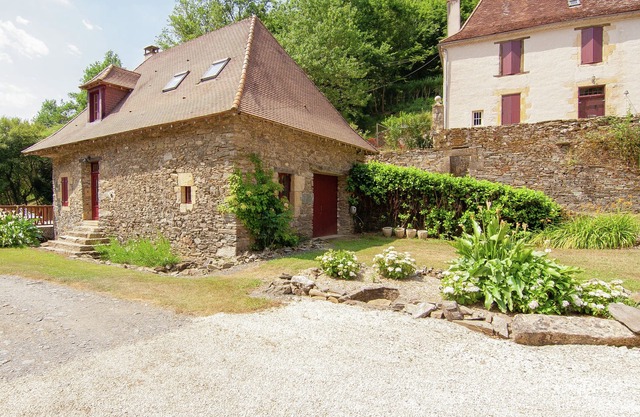 Holiday home near river with pool
