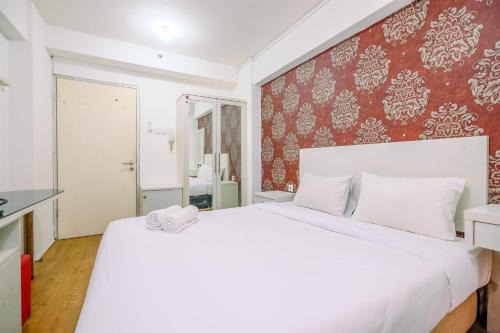Homey and Fully Furnished Studio at Green Bay Pluit Apartment By Travelio
