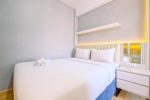 Homey and Modern Look 2BR Transpark Cibubur Apartment By Travelio