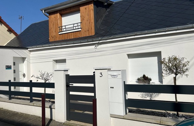 House near the sea with land