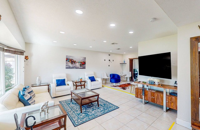 Ideally located home with enclosed pool, grill, W/D, & AC - snowbird-friendly