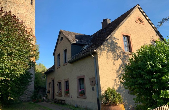 Idyllic mill building directly on the city wall with a large garden