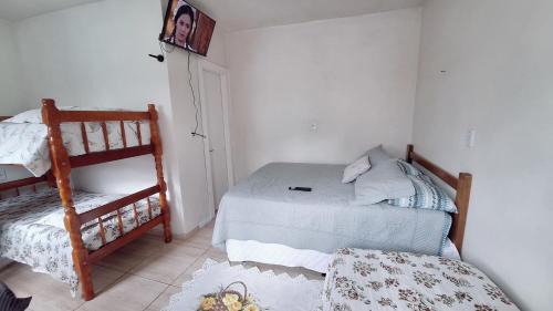 KITNET S1 em TORRES-RS - Na mais bela praia Gaúcha - Cozinha - Banheiro - Ar condicionado - TV e Wi-Fi - Estacionamento - Anfitriã Superhost no BnB