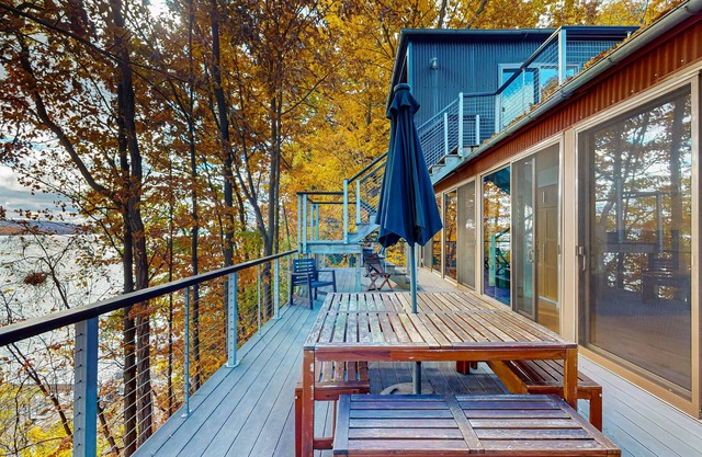 Lakefront contemporary gem with decks, lake views & pebble beach