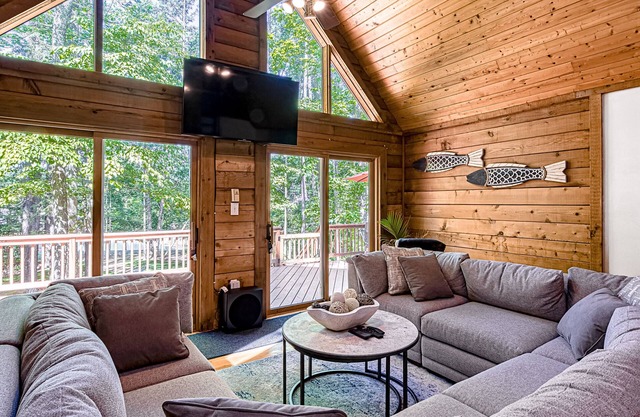 Lakefront home with boat mooring, deck, hot tub, game room & fast WiFi - dogs OK