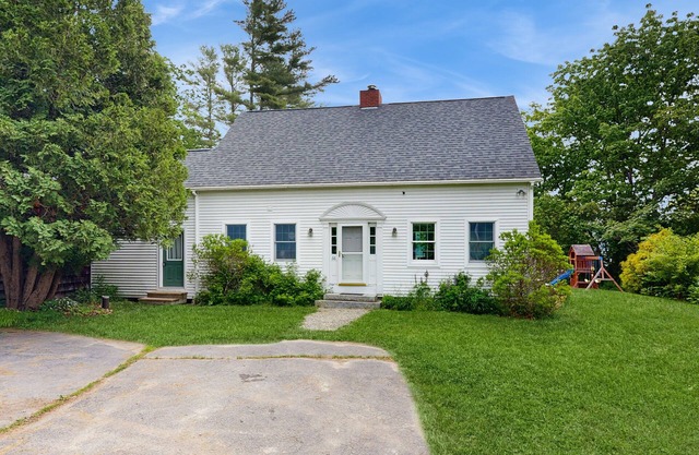 Lakefront home with large yard, screened porch & amazing views